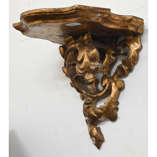 132 - A pair of giltwood and gesso foliate bracket shelves, 20 cm wide x 20 cm high