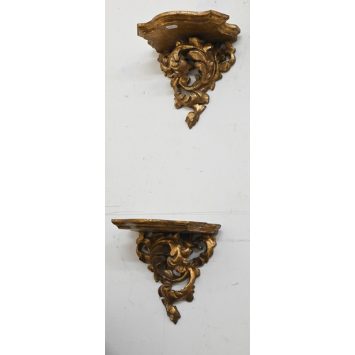 132 - A pair of giltwood and gesso foliate bracket shelves, 20 cm wide x 20 cm high