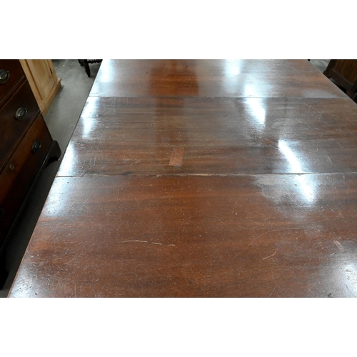 134 - A Regency style mahogany twin pedestal dining table with single central leaf, 200 x 110 x 76 cm high