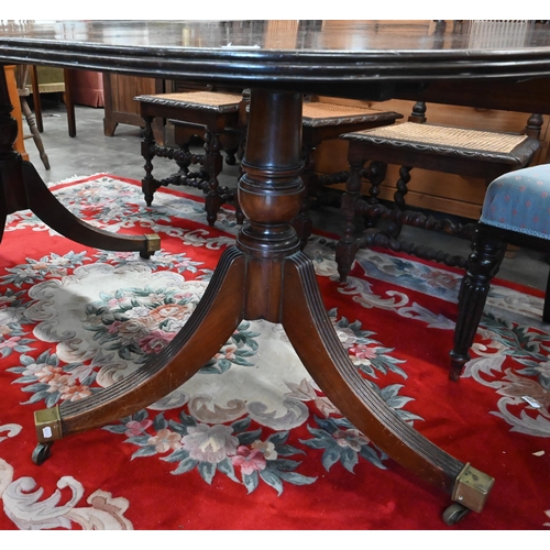 134 - A Regency style mahogany twin pedestal dining table with single central leaf, 200 x 110 x 76 cm high