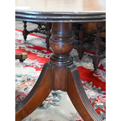 134 - A Regency style mahogany twin pedestal dining table with single central leaf, 200 x 110 x 76 cm high