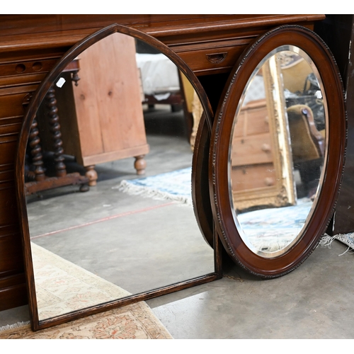 145 - A Gothic arch wall mirror in stained hardwood frame, 62 cm wide x 84 cm high to/w bevelled oval maho... 