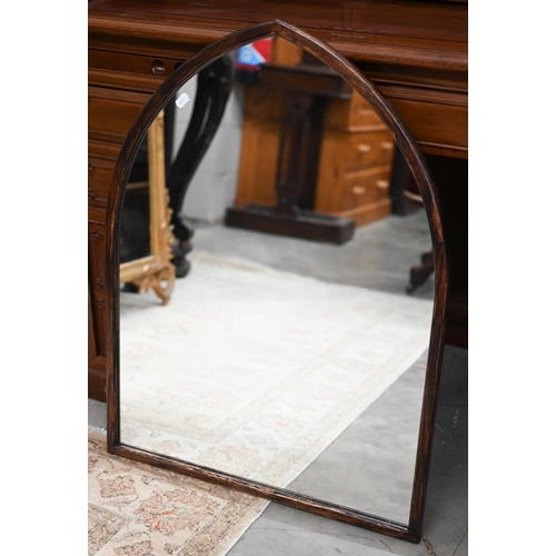 145 - A Gothic arch wall mirror in stained hardwood frame, 62 cm wide x 84 cm high to/w bevelled oval maho... 