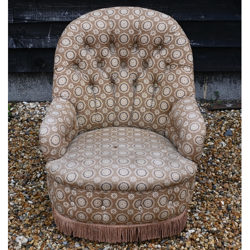 146 - A button back low armchair with floral fabric