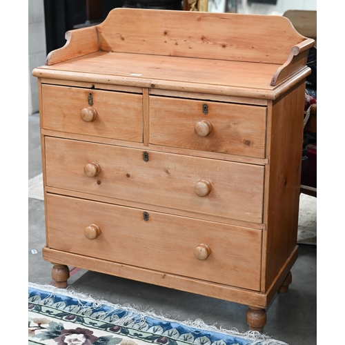 15 - A Parana pine chest with galleried top over two short and two long drawers on turned feet, 90 x 104 ... 