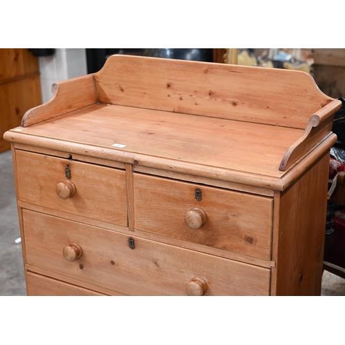 15 - A Parana pine chest with galleried top over two short and two long drawers on turned feet, 90 x 104 ... 