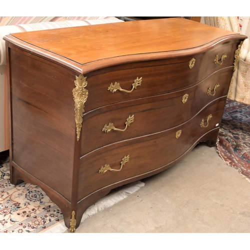 151 - A French style brass mounted commode trunk with serpentine front and hinged top and three dummy draw... 