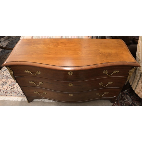 151 - A French style brass mounted commode trunk with serpentine front and hinged top and three dummy draw... 