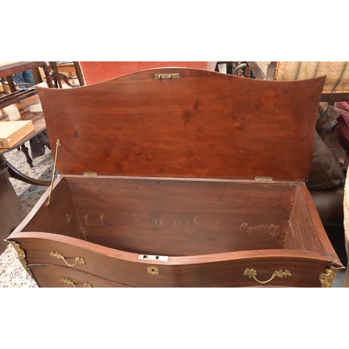 151 - A French style brass mounted commode trunk with serpentine front and hinged top and three dummy draw... 