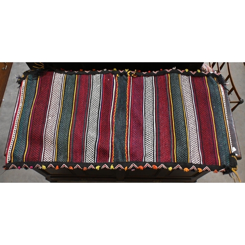 152 - Persian saddle bags (double) with multicoloured banded design to/w blue ground (worn) Kurdish rug (2... 