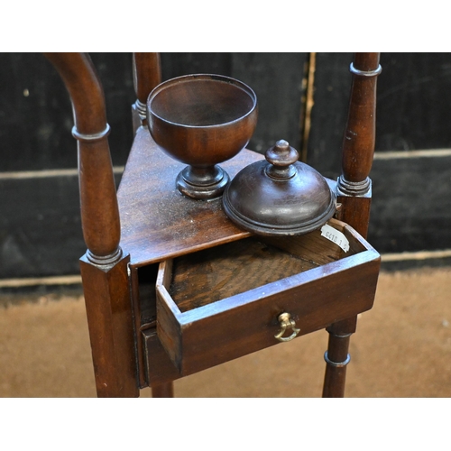 153 - A mahogany shaving stand with two drawers on triform suports, 186 cm