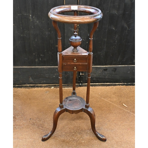 153 - A mahogany shaving stand with two drawers on triform suports, 186 cm