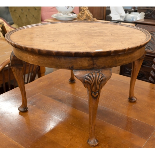 155 - A walnut circular coffee table with scalloped circular quarter veneered top on shell carved cabriole... 