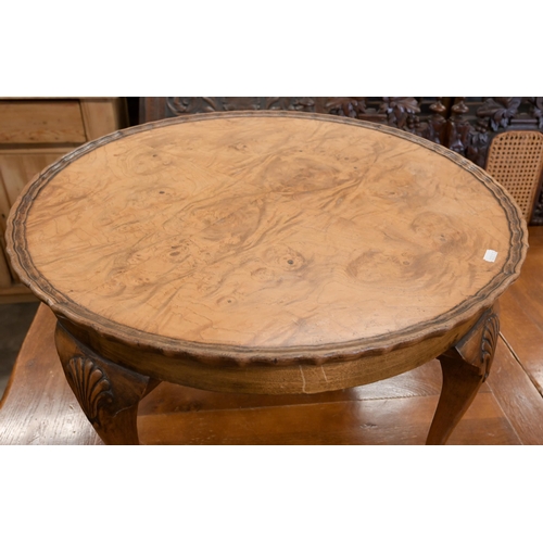 155 - A walnut circular coffee table with scalloped circular quarter veneered top on shell carved cabriole... 