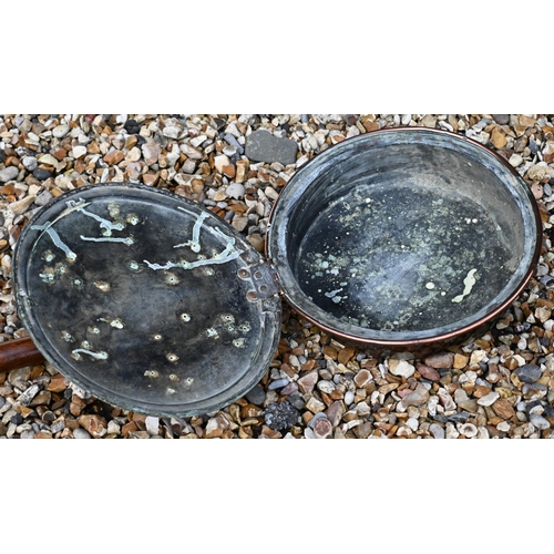 164 - A pair of large scalloped polished pewter chargers, 46 cm diam to/w copper warming pan (2)