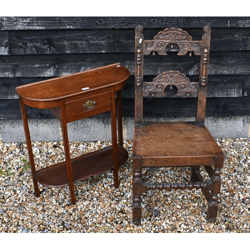 167 - A small oak bowfront hall table with drawer and open undertier, 64 x 22 x 70 cm high to/w a carved o... 