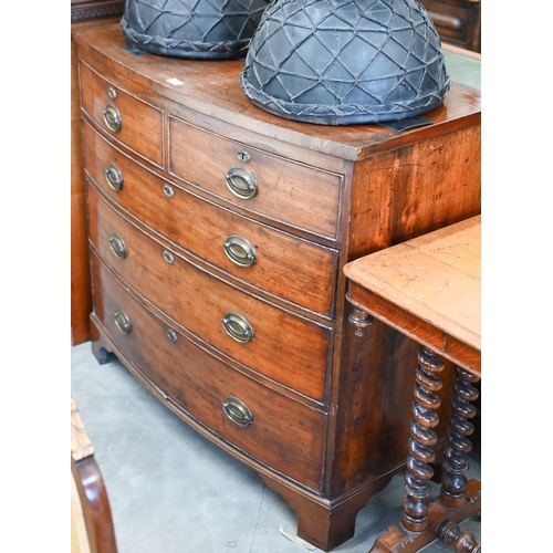 17 - A 19th century mahogany bowfront chest of two short over three long drawers raised on bracket feet, ... 