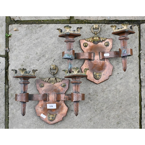 174 - A pair of Arts and Crafts copper and brass Gothic style twin branch sconces, 25 cm high