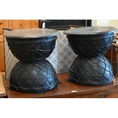 19 - A pair of black painted and lattice leather work Diablo side tables, 48 cm diam x 45 cm high