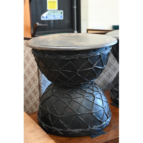 19 - A pair of black painted and lattice leather work Diablo side tables, 48 cm diam x 45 cm high