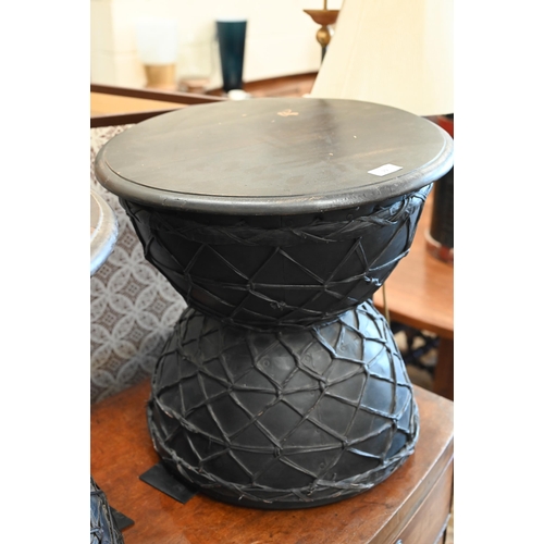 19 - A pair of black painted and lattice leather work Diablo side tables, 48 cm diam x 45 cm high