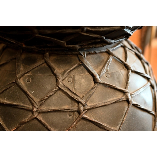 19 - A pair of black painted and lattice leather work Diablo side tables, 48 cm diam x 45 cm high