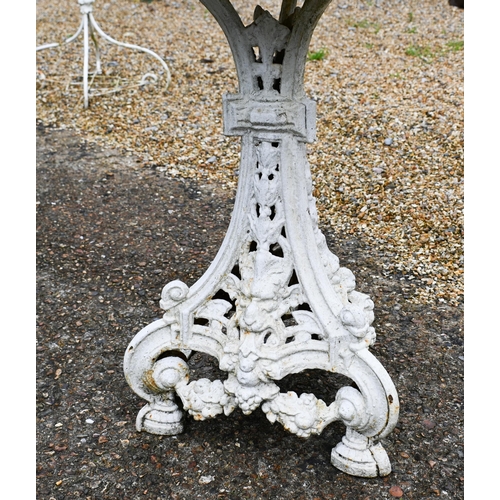 201 - A small circular cast iron terrace table, painted white, 57 cm dia. x 68 cm h to/w a similar cast ir... 