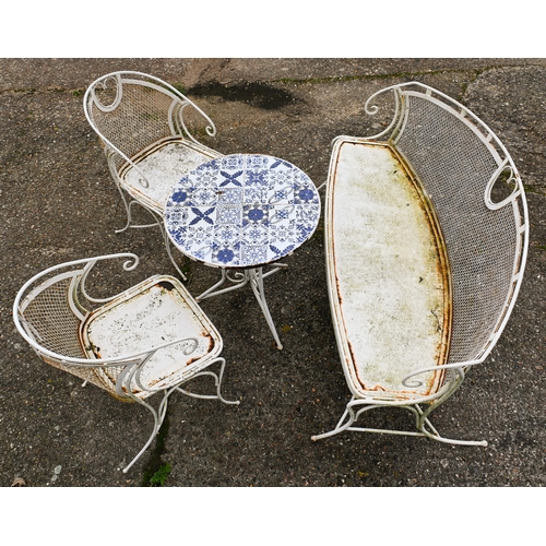 202 - A circular tile top terrace table to/with a pair of chairs and a wire back bench, 145 cm long, all w... 