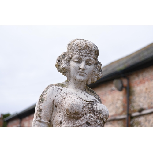 208 - A weathered 1920s style garden statue, female, 77 cm h