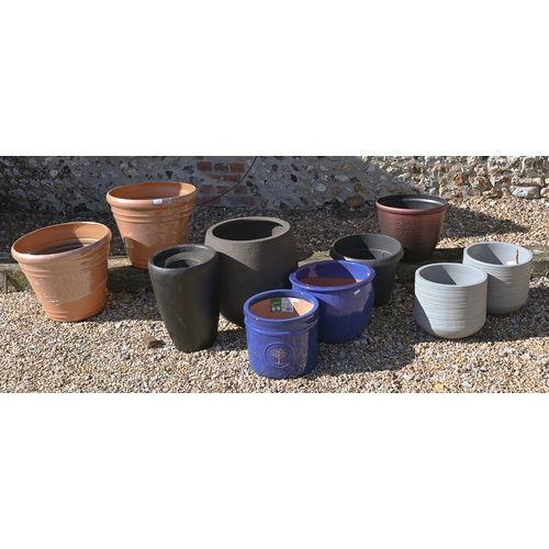 209 - An assortment of new ex-stock composite garden planters to/w blue glazed pottery planters (10)