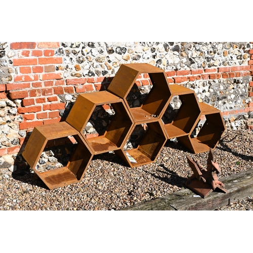 210 - Blumfeldt, six hexagonal steel stacking log store bins, each 50 cm dia. surface rust due to exposure... 