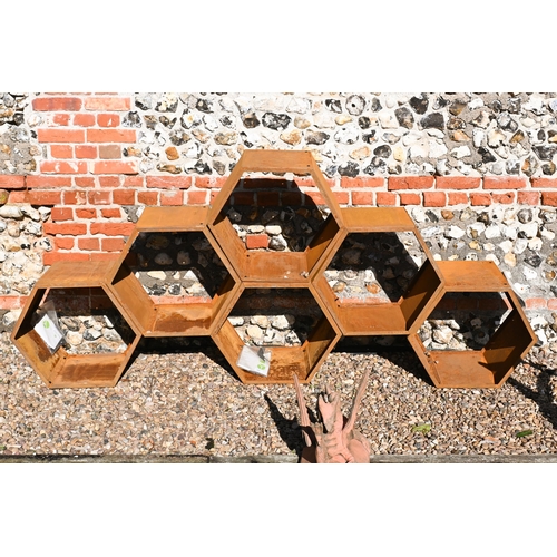 210 - Blumfeldt, six hexagonal steel stacking log store bins, each 50 cm dia. surface rust due to exposure... 