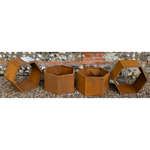 210 - Blumfeldt, six hexagonal steel stacking log store bins, each 50 cm dia. surface rust due to exposure... 