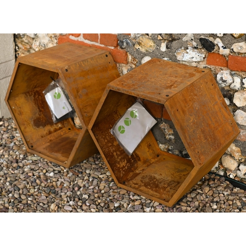 210 - Blumfeldt, six hexagonal steel stacking log store bins, each 50 cm dia. surface rust due to exposure... 