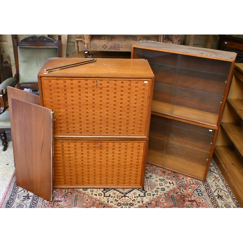 Poul Cadovius for Cado, Denmark - a modular teak wall system comprising a pair of basket form cabinets, a pair of sliding glass front cabinets and two shelves, c/with wall mounts and brackets - as removed