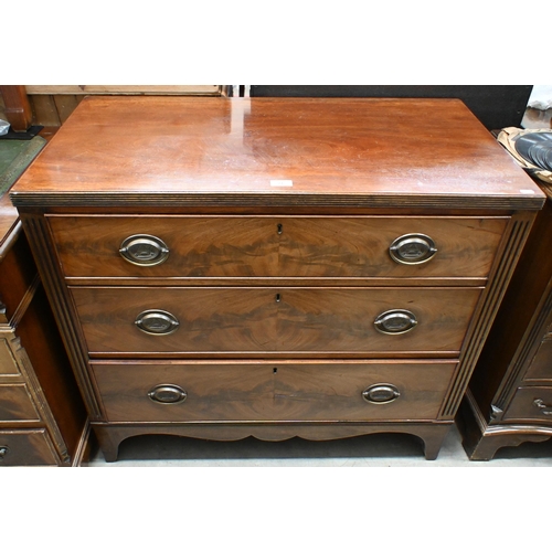 24 - A 19th century mahogany chest of three long graduating drawers (one front foot cut down/reduced), 94... 