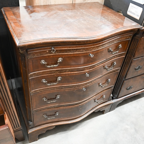 25 - A reproduction mahogany serpentine front chest with brushing slide over four drawers raised on brack... 