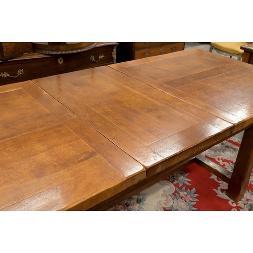 30 - An cherry wood extending dining table with single central leaf, square supports and stretcher, 230 x... 