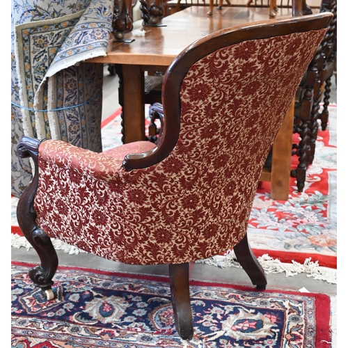 31 - Victorian mahogany spoon back armchair with floral upholstery