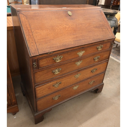 35 - A Georgian mahogany bureau with fall front panel and four long graduating drawers on bracket feet, a... 