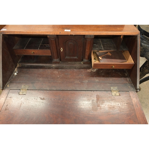 35 - A Georgian mahogany bureau with fall front panel and four long graduating drawers on bracket feet, a... 