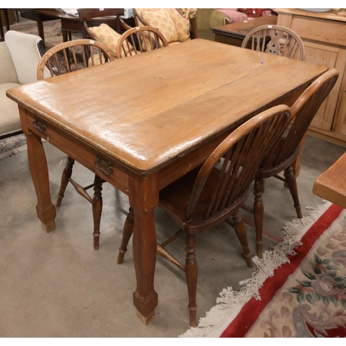 36 - An antique fruitwood kitching dining table with end drawer and shaped supports, 138 x 90 x 76 cm to/... 