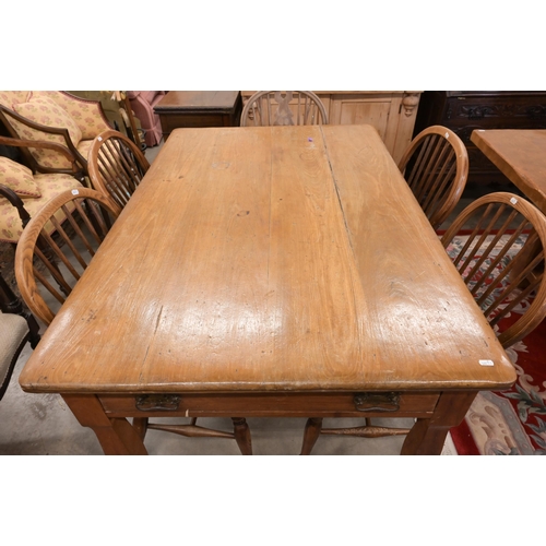 36 - An antique fruitwood kitching dining table with end drawer and shaped supports, 138 x 90 x 76 cm to/... 