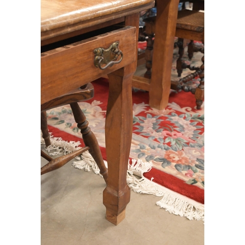 36 - An antique fruitwood kitching dining table with end drawer and shaped supports, 138 x 90 x 76 cm to/... 