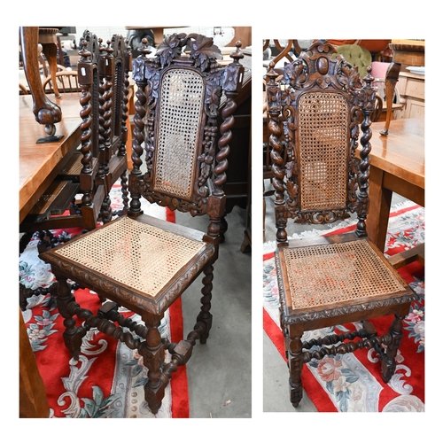 40 - # Five Victorian Gothic revival carved oak dining chairs with woven cane backs and seats (5)