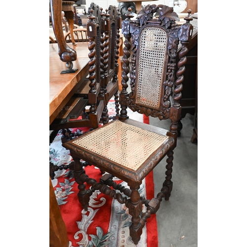 40 - # Five Victorian Gothic revival carved oak dining chairs with woven cane backs and seats (5)