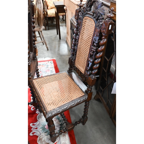 40 - # Five Victorian Gothic revival carved oak dining chairs with woven cane backs and seats (5)