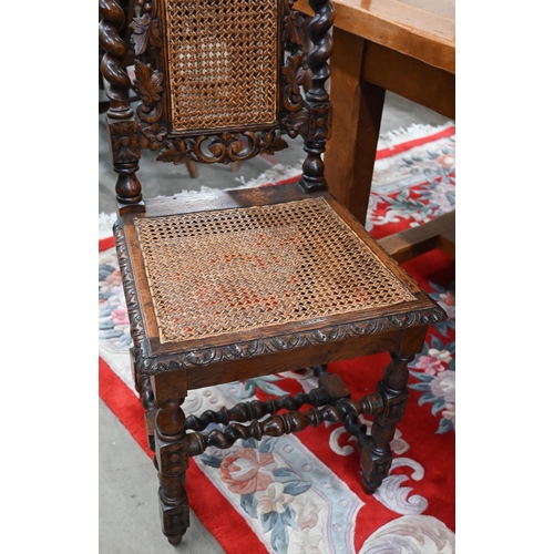 40 - # Five Victorian Gothic revival carved oak dining chairs with woven cane backs and seats (5)