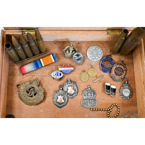 471 - A .5 calibre bullet, the casing concealing a cigarette lighter, to/w Army cap badges including Royal... 