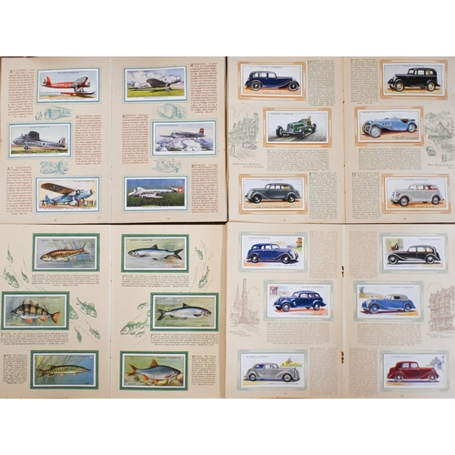 481 - Twenty-three albums of Players cigarette cards, including sports and film stars, ships, aeroplanes a... 